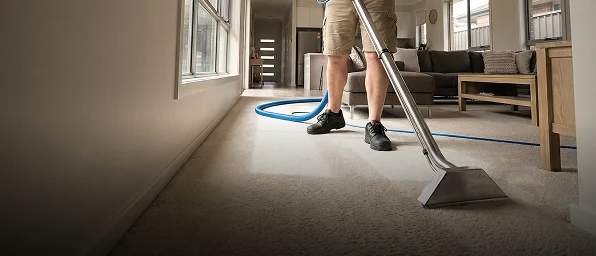 Hot steam carpet cleaning wand extracting dirt from bedroom carpet in a Melbourne home